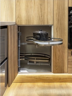 Corner cabinet with pull-out carousel shelves